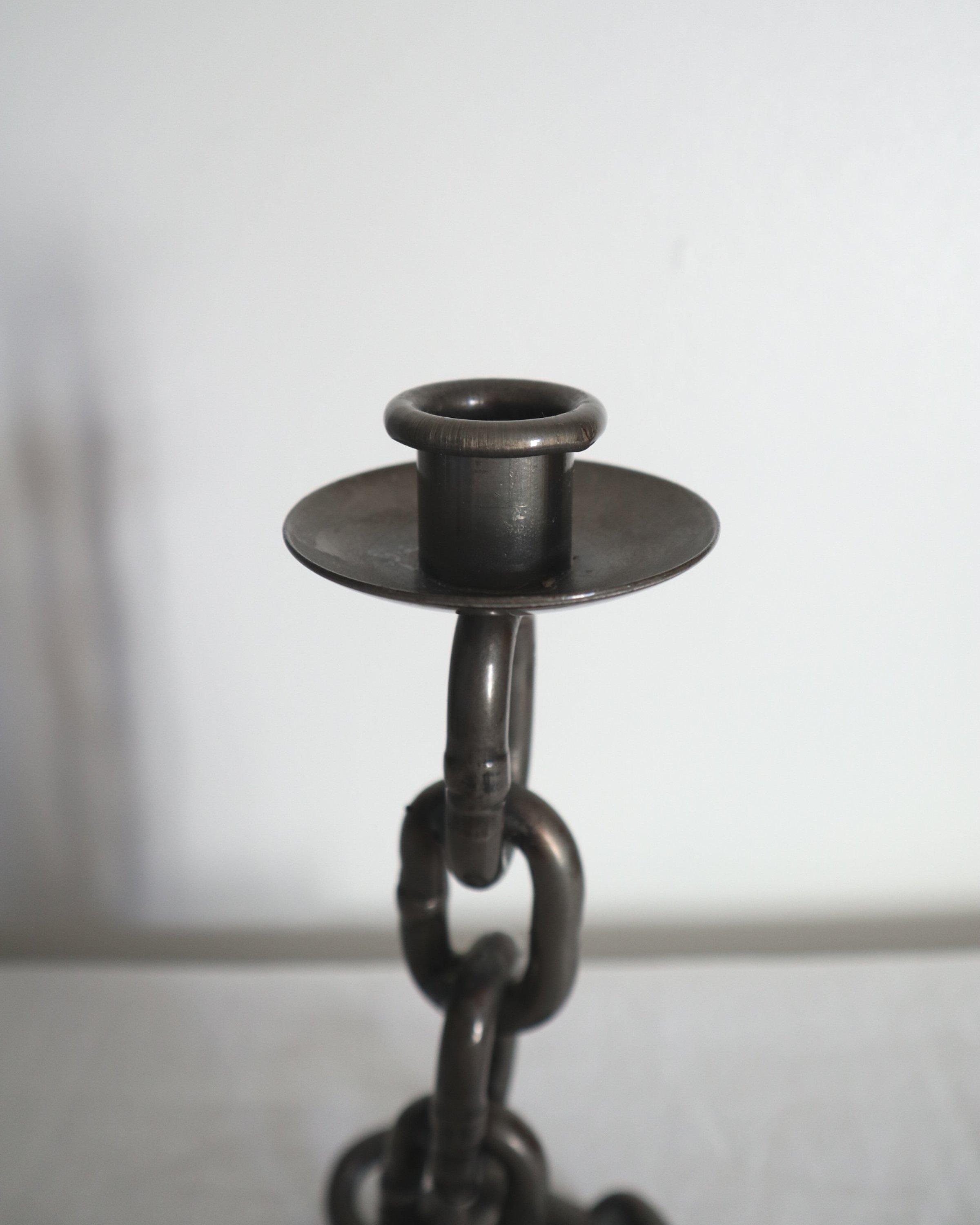 Heavy, vintage Brutalist chain link candlestick made from lacquered grey forged iron.