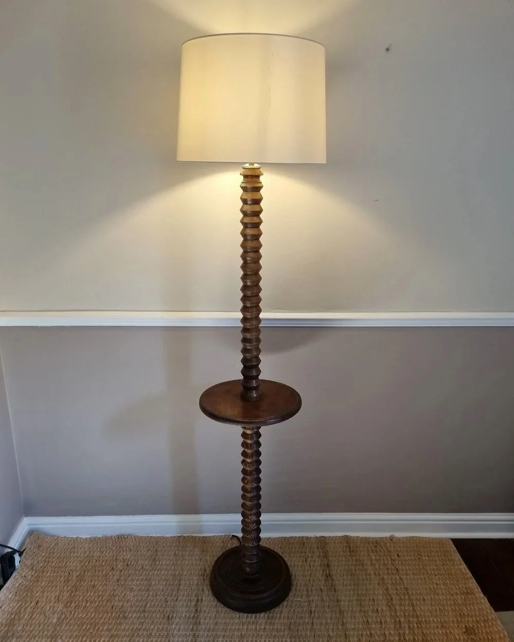 French, tall carved wooden Brutalist floor lamp with shelf platform in the manner of Charles Dudouyt, circa 1940s.