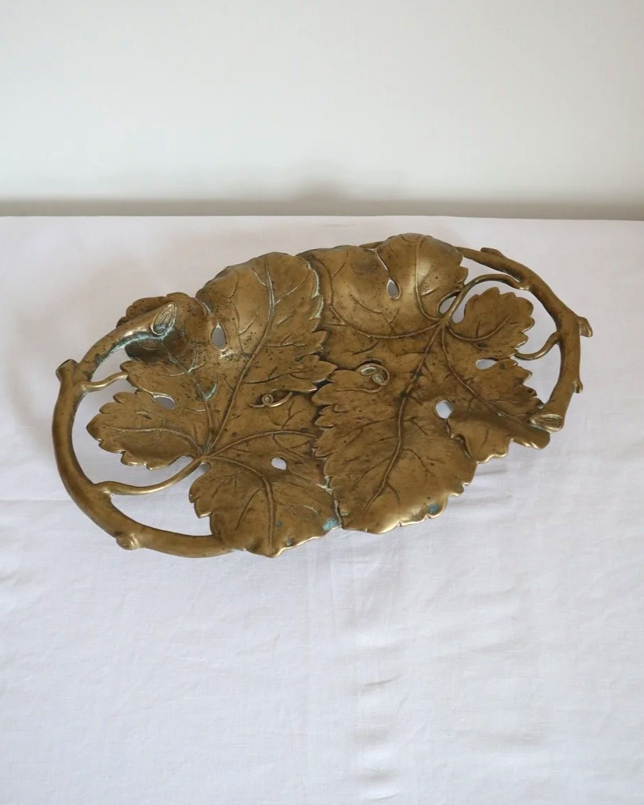 Vintage solid brass decorative Art Nouveau dish of intertwined grapevine leaves, circa 1960s.