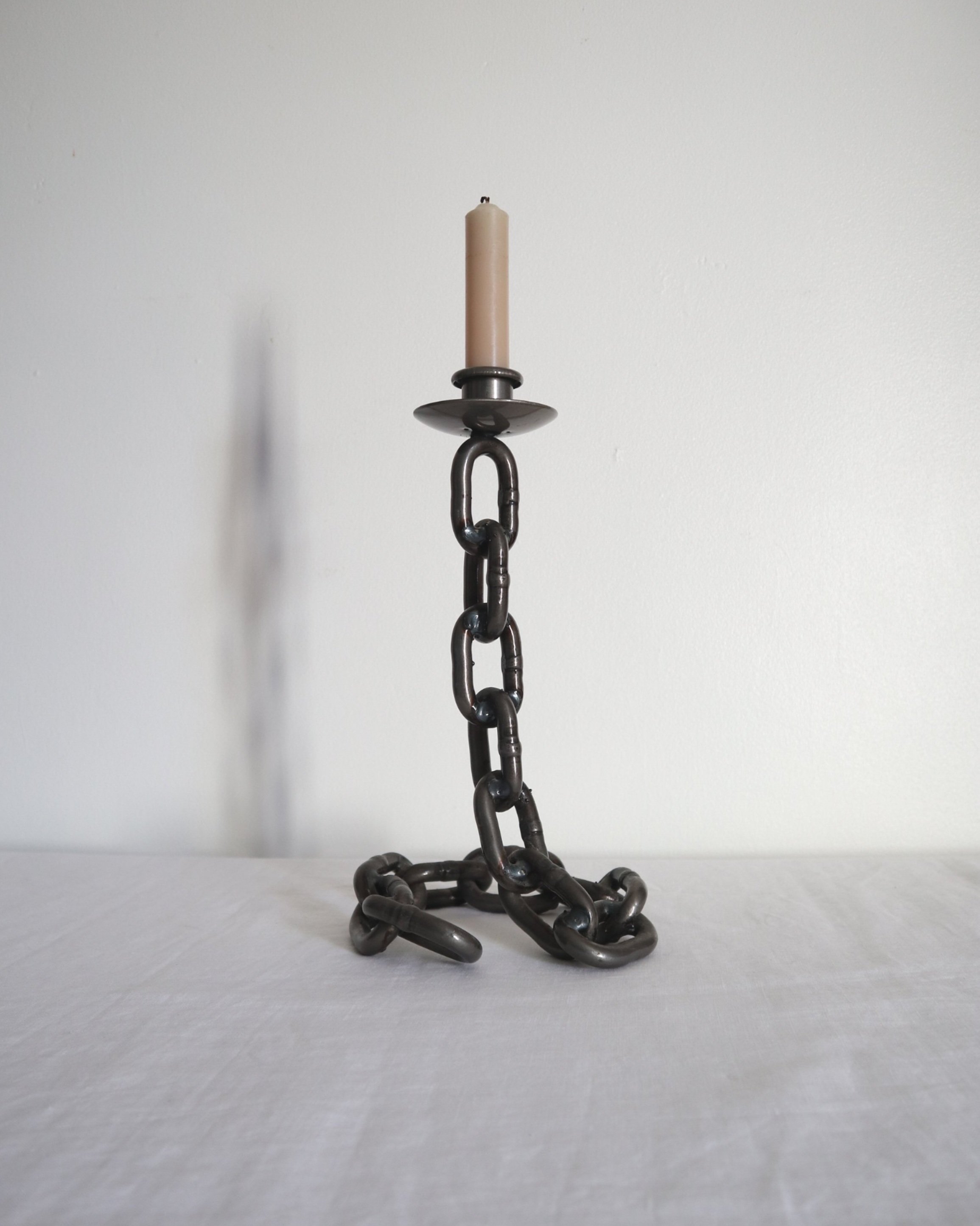 Heavy, vintage Brutalist chain link candlestick made from lacquered grey forged iron.