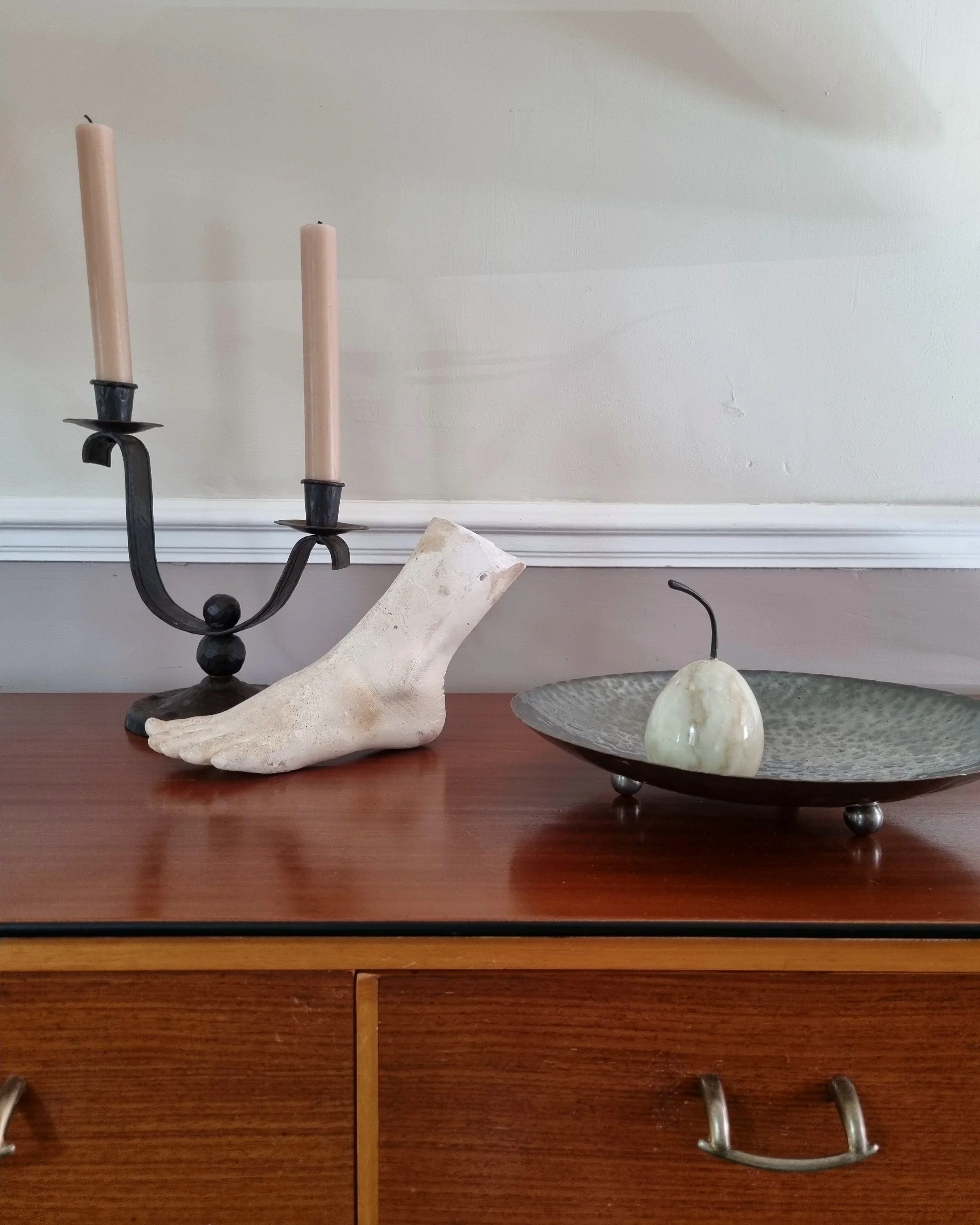 Classical-style decorative plaster foot sculpture, likely used as an anatomical or art studio study model.