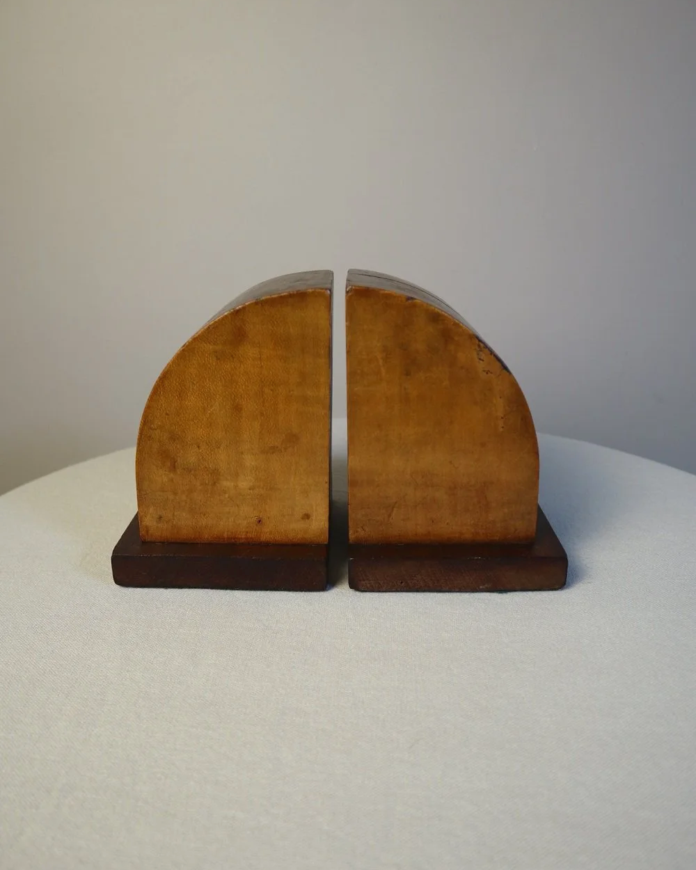 Vintage Art Deco style two tone arched wooden bookends.