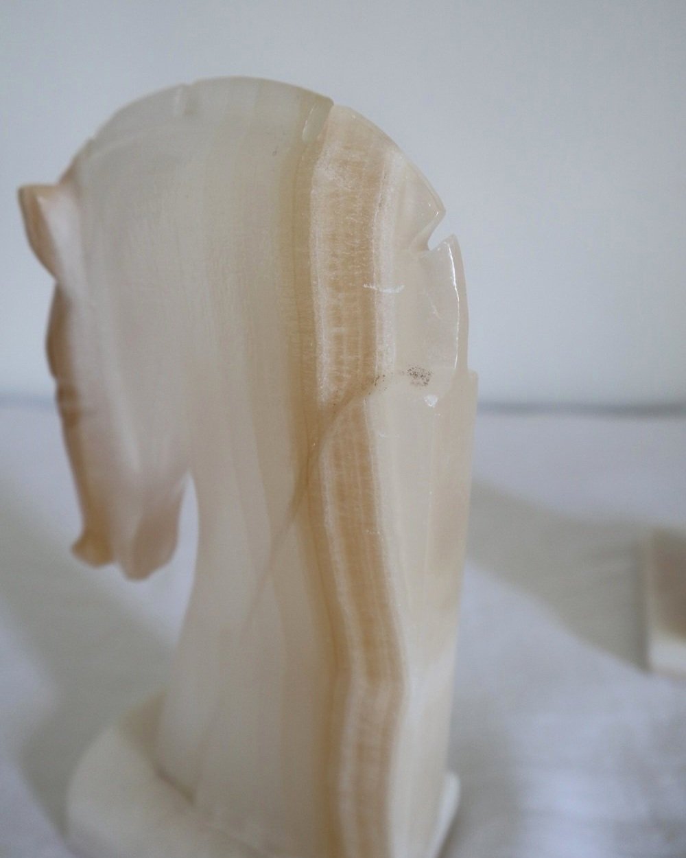 pair of tall white onyx Trojan horse head bookends.