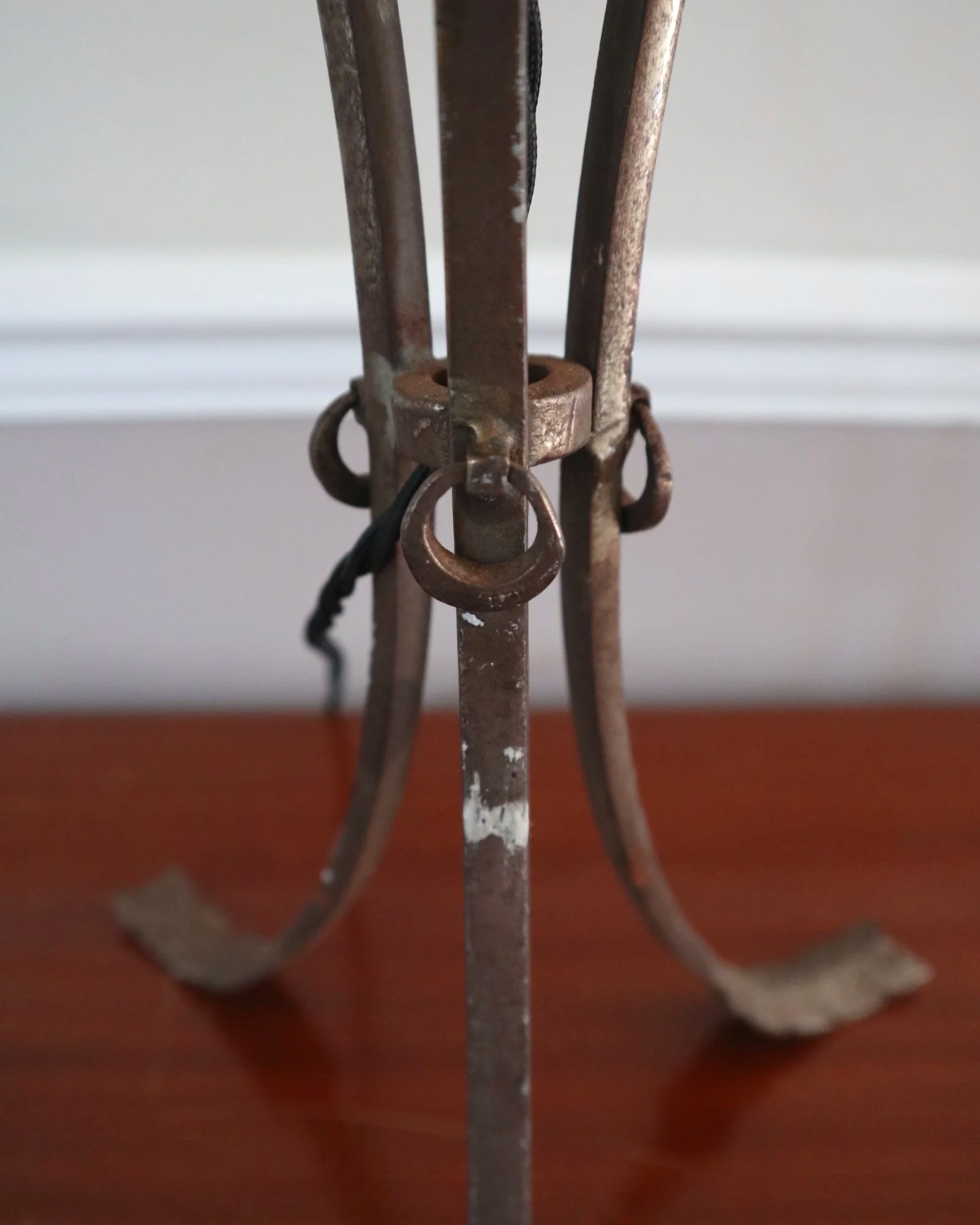 Pair of French style mid century metal tripod table lamps featuring three arrows.