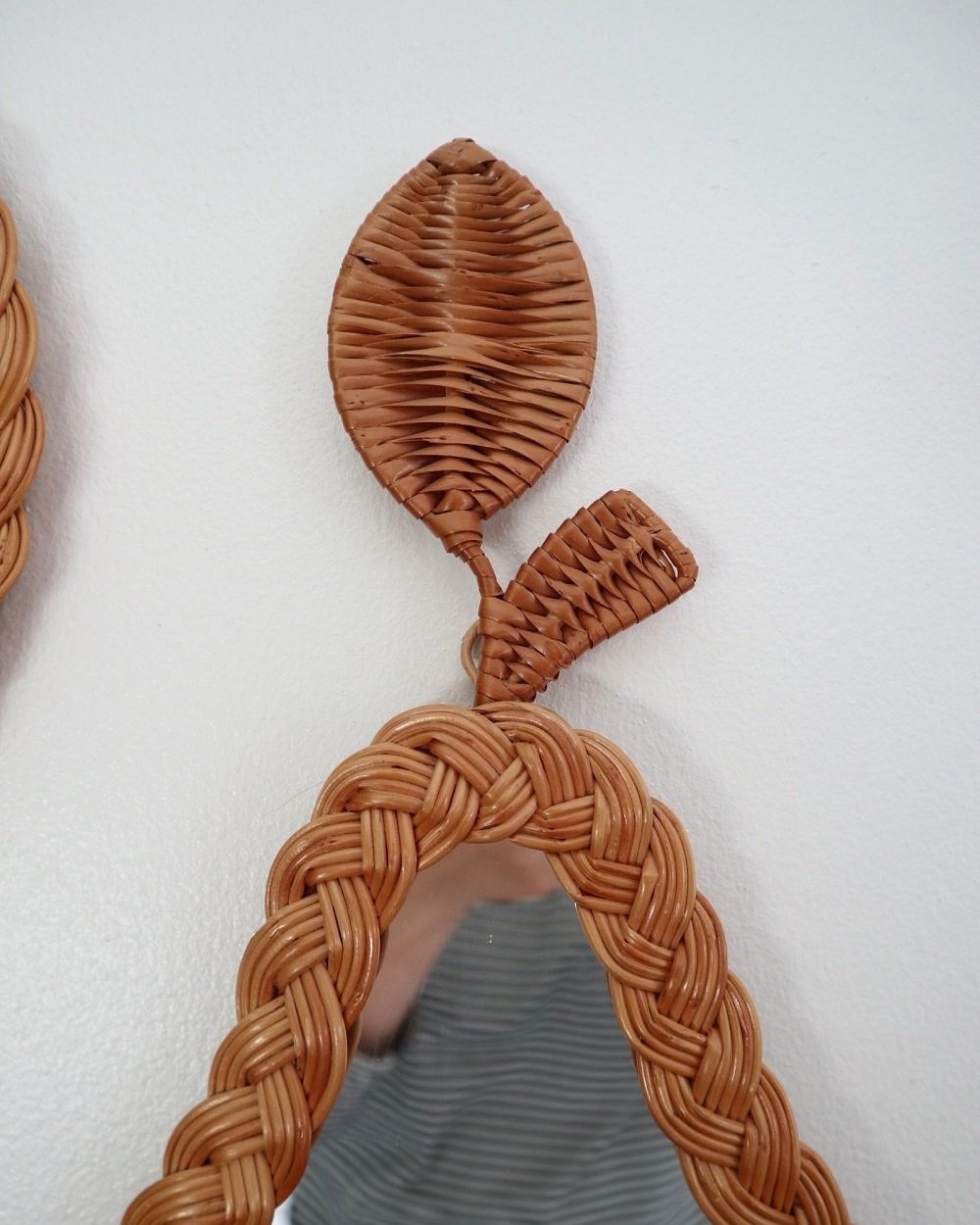 Pair of vintage small wall mirrors in the shape of an apple and a pear, with woven wicker frames.