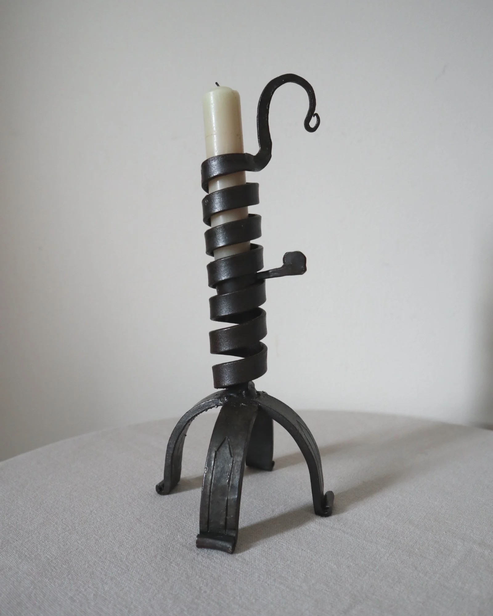 Vintage wrought iron ‘rat de cave’ style candleholder with turning spiral mechanism which raises the candle as it burns lower.
