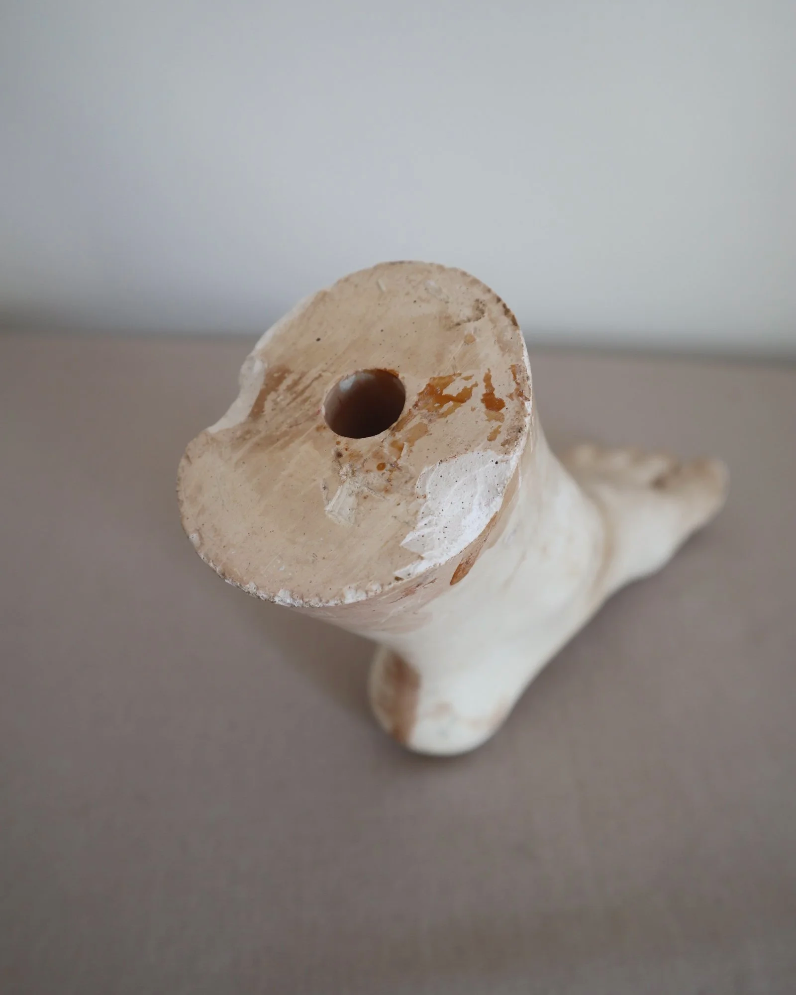 Classical-style decorative plaster foot sculpture, likely used as an anatomical or art studio study model.