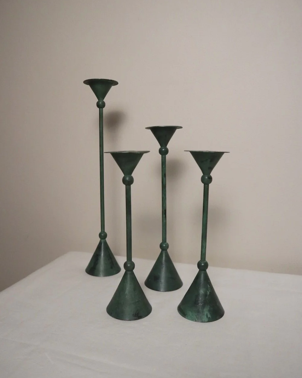Set of 4 Postmodern verdigris metal candleholders, circa 1980s. In the Memphis style of Christian de Beaumont.