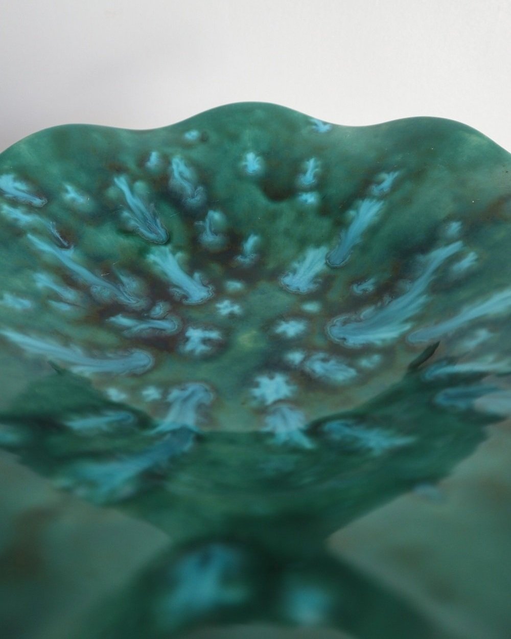 Studio pottery vibrant blue green shiny drip glaze pedestal cake stand / dish with wavy edge.