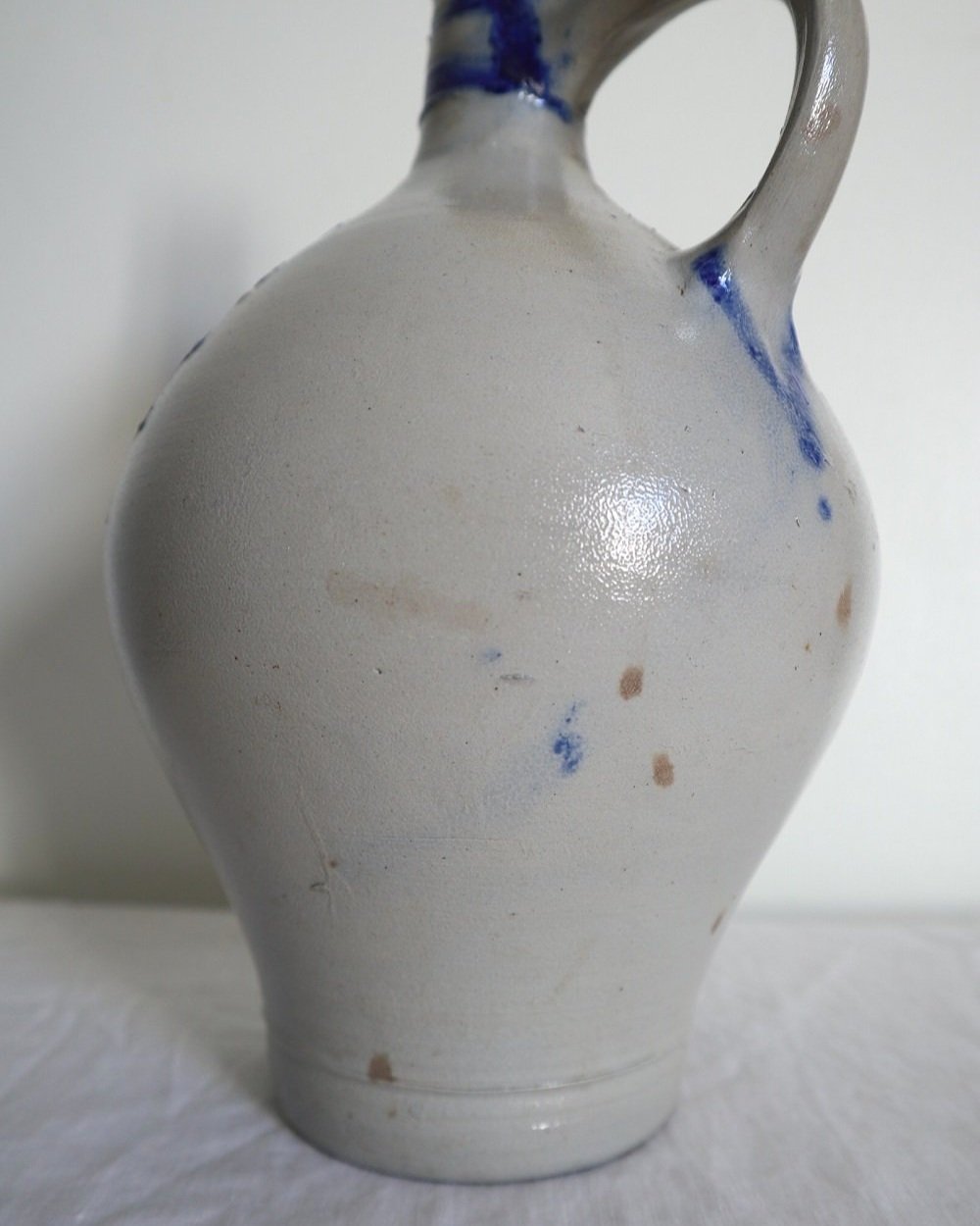 Large vintage German Westerwald salt glazed stoneware flagon with cobalt blue foliage decoration and two bands to the neck.