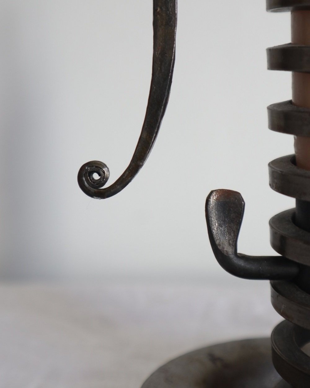 Vintage French 'Rat de cave' iron candleholder with turning spiral mechanism and signature curled handle. Circa 1970s. Marked 'Bourgogne Bouillot 71220 France'.