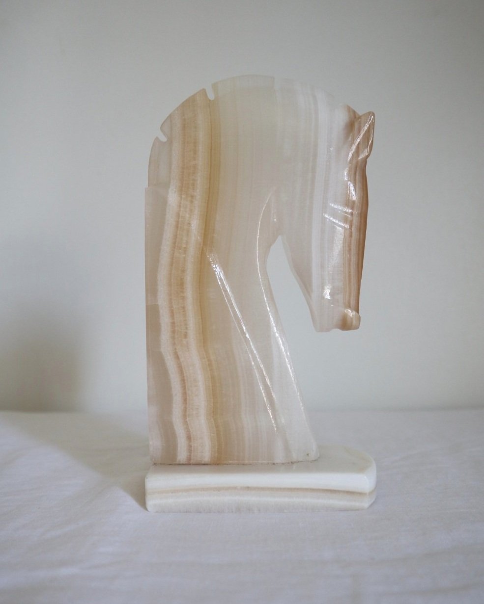 pair of tall white onyx Trojan horse head bookends.