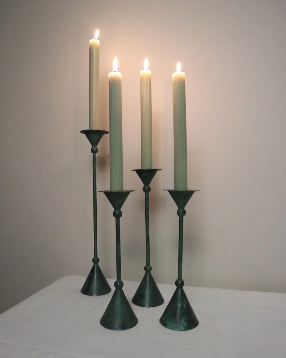 Set of 4 Postmodern verdigris metal candleholders, circa 1980s. In the Memphis style of Christian de Beaumont.
