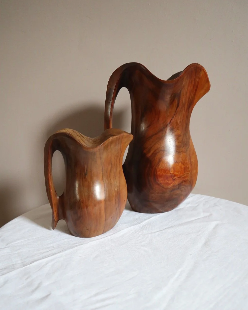 Small mid century hand carved sculptural olivewood jug in the style of Alexandre Noll. Circa 1960s.
