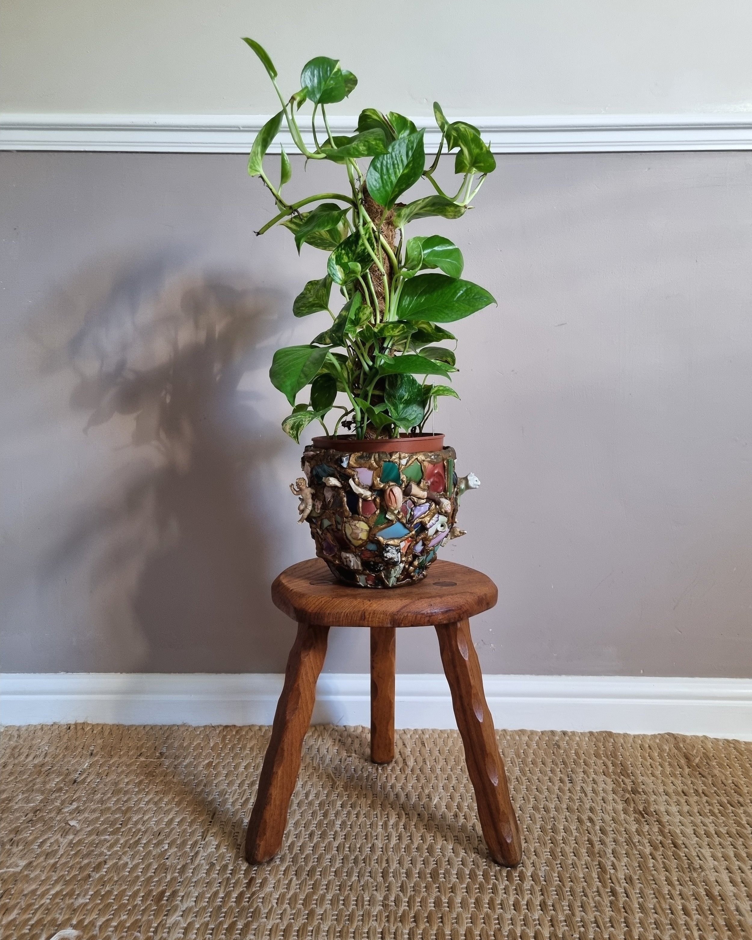 Vintage rustic handmade warm wooden tripod stool with carved legs. Stamped 'John Chapman Woodcrafts Northwood'.