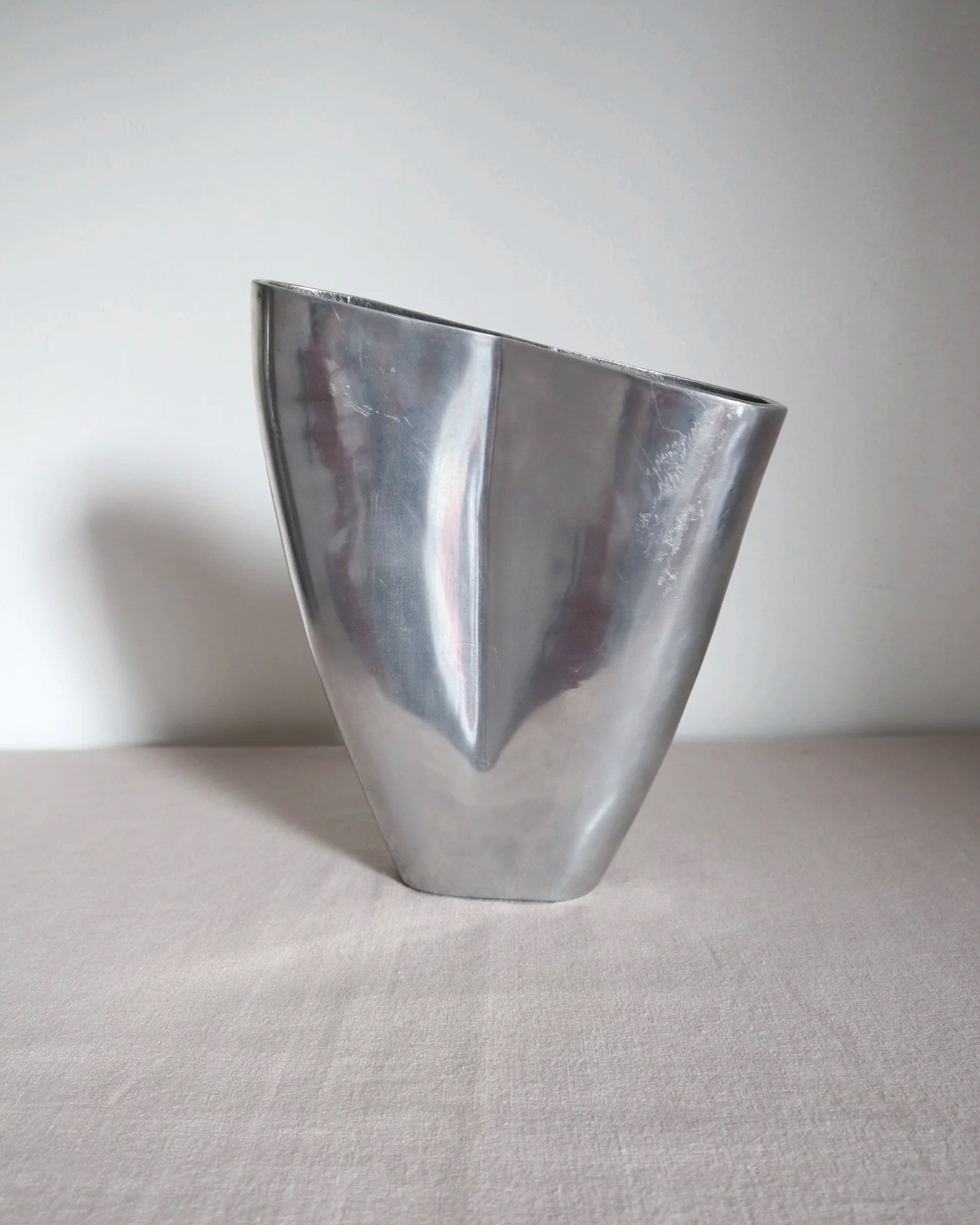 Postmodern heavy cast aluminium vase with sculptural form and four small inset stones. In the style of Anna Efverlund. Circa 1980s. Unsigned.
