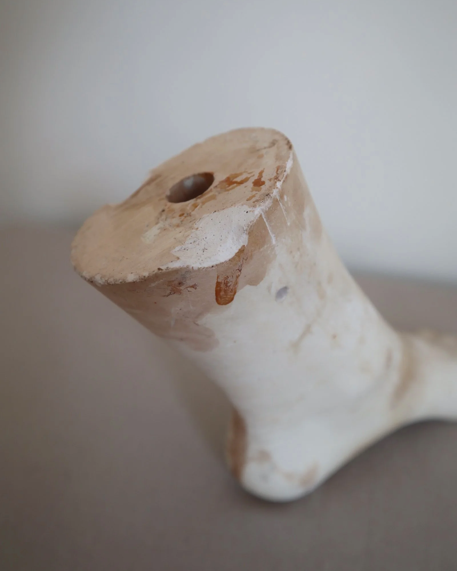 Classical-style decorative plaster foot sculpture, likely used as an anatomical or art studio study model.