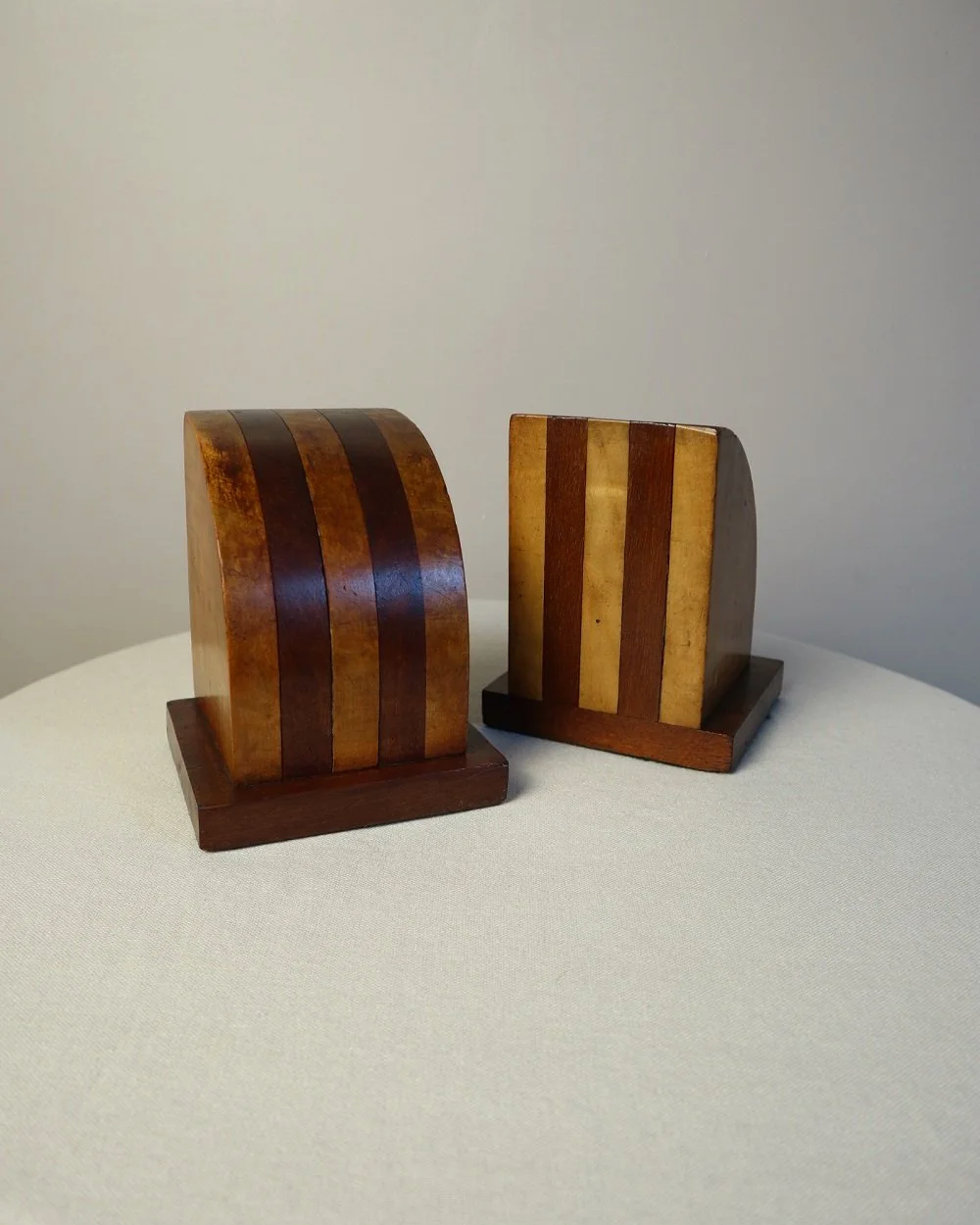 Vintage Art Deco style two tone arched wooden bookends.