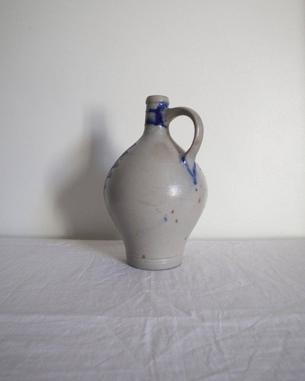 Large vintage German Westerwald salt glazed stoneware flagon with cobalt blue foliage decoration and two bands to the neck.
