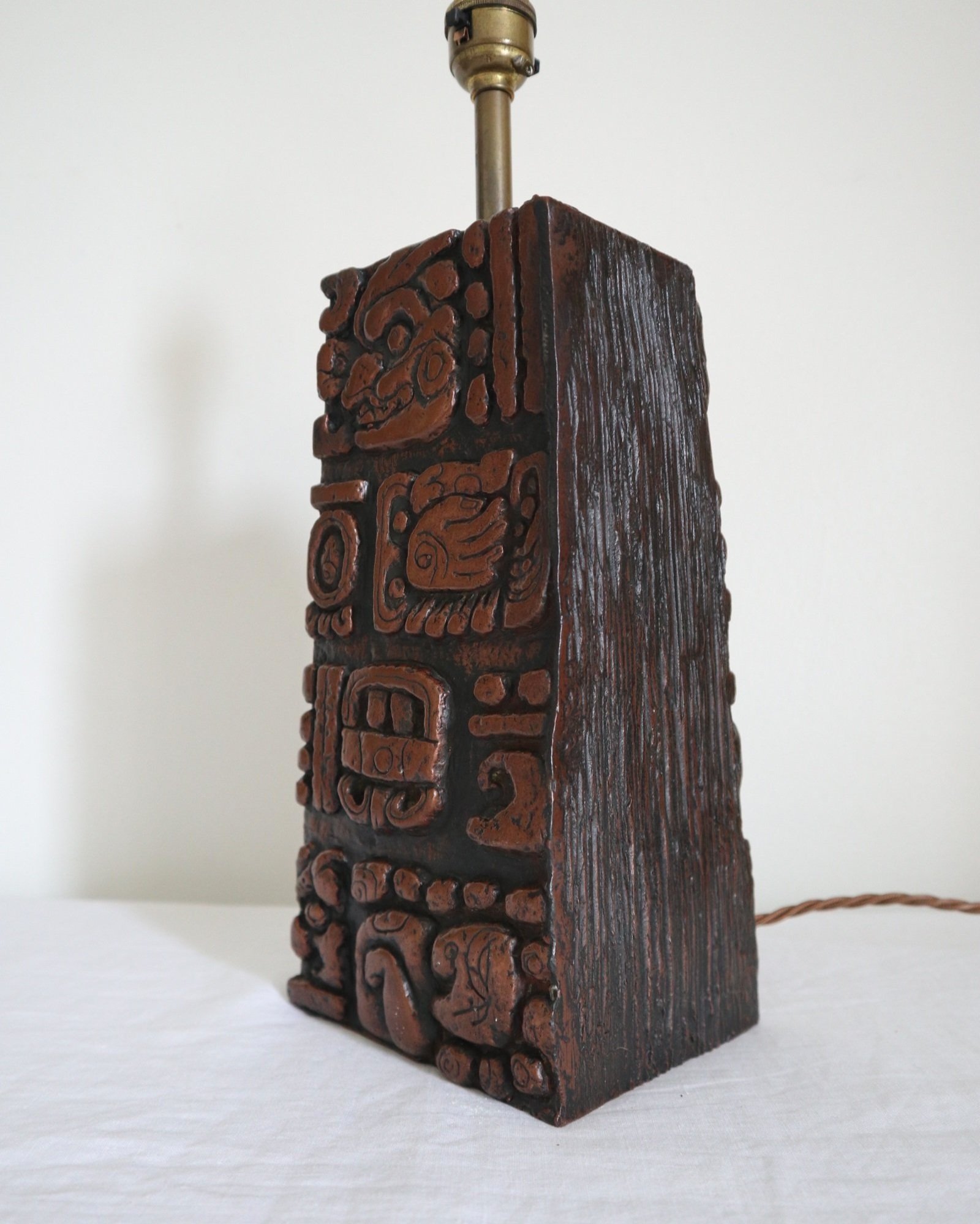 Mid century very heavy Brutalist Aztec style cast resin table lamp with metallic bronze finish.