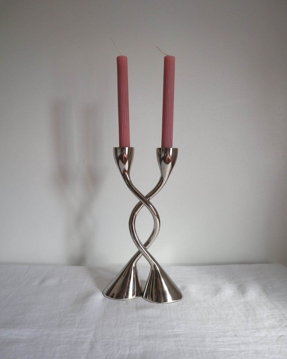 Pair of sculptural solid aluminium candleholders, circa 1970s.
