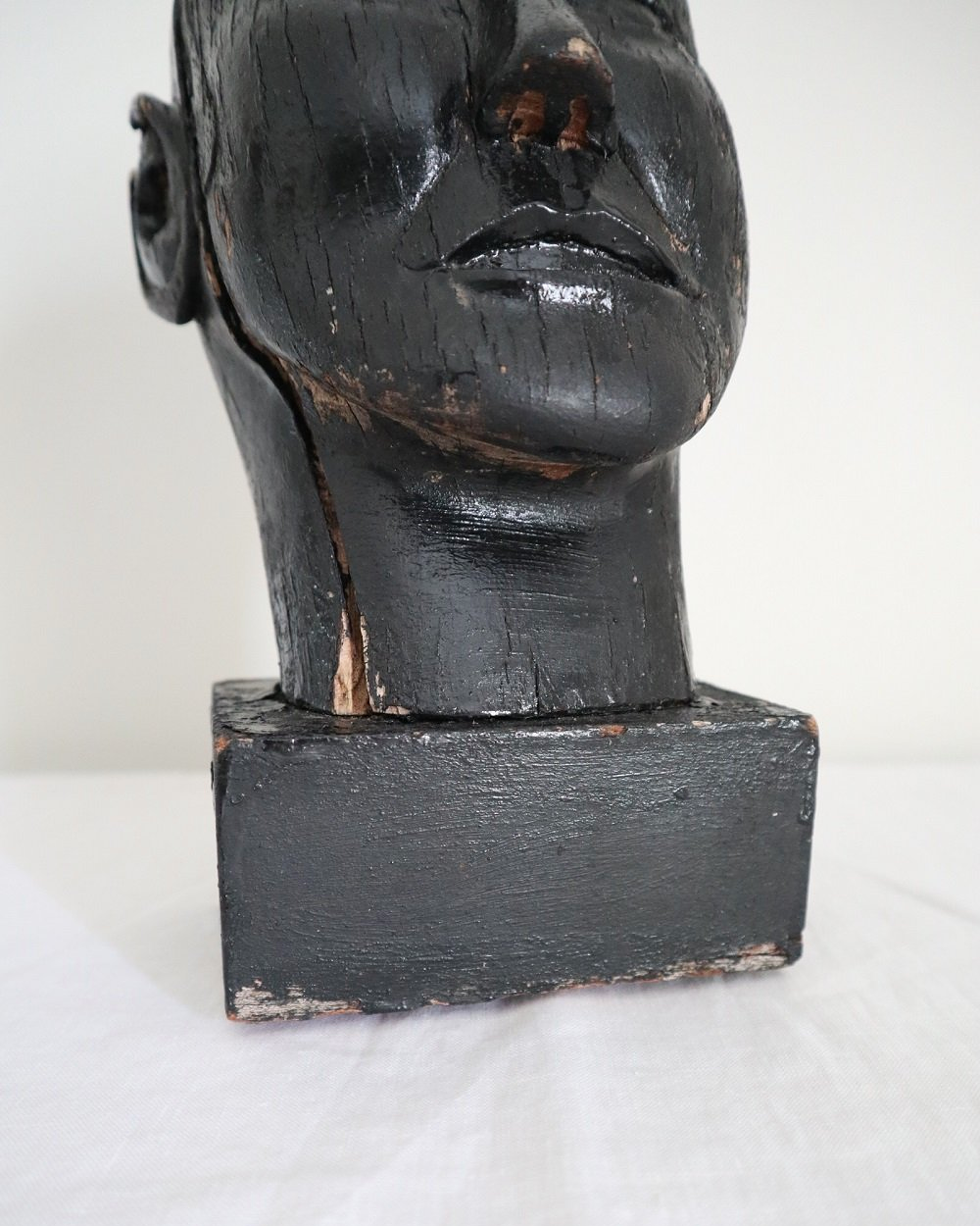 Vintage hand carved black painted wooden sculpture of male head. Age unknown.