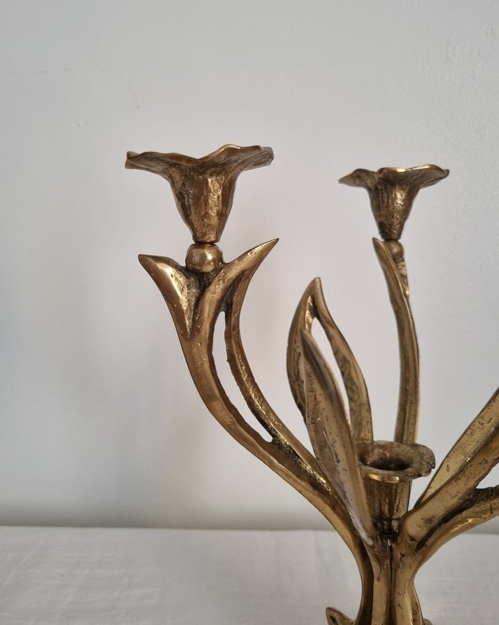 Mid century Art Nouveau style floral heavy brass candelabra with three arms and central candleholder. Circa 1970s.