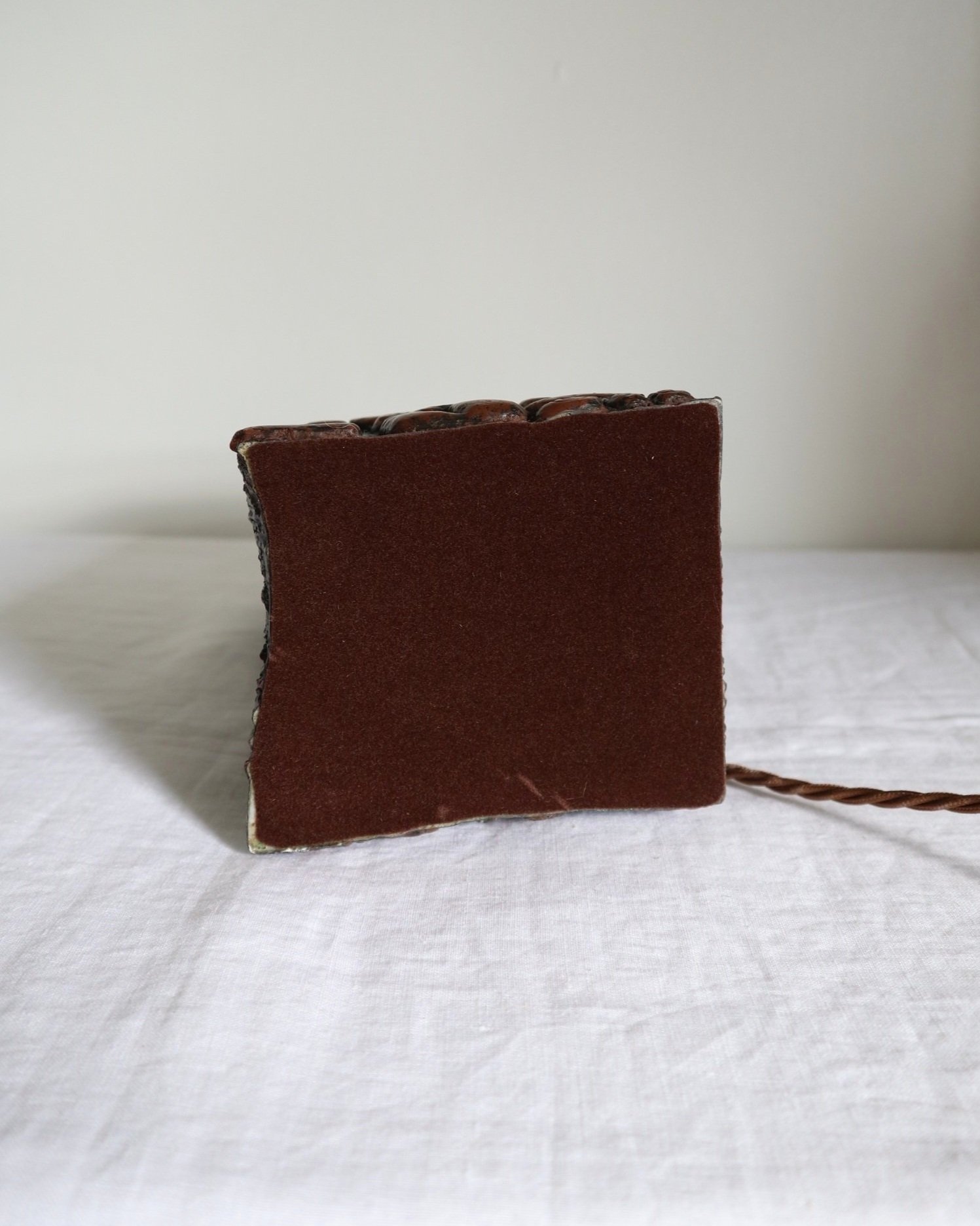 Mid century very heavy Brutalist Aztec style cast resin table lamp with metallic bronze finish.