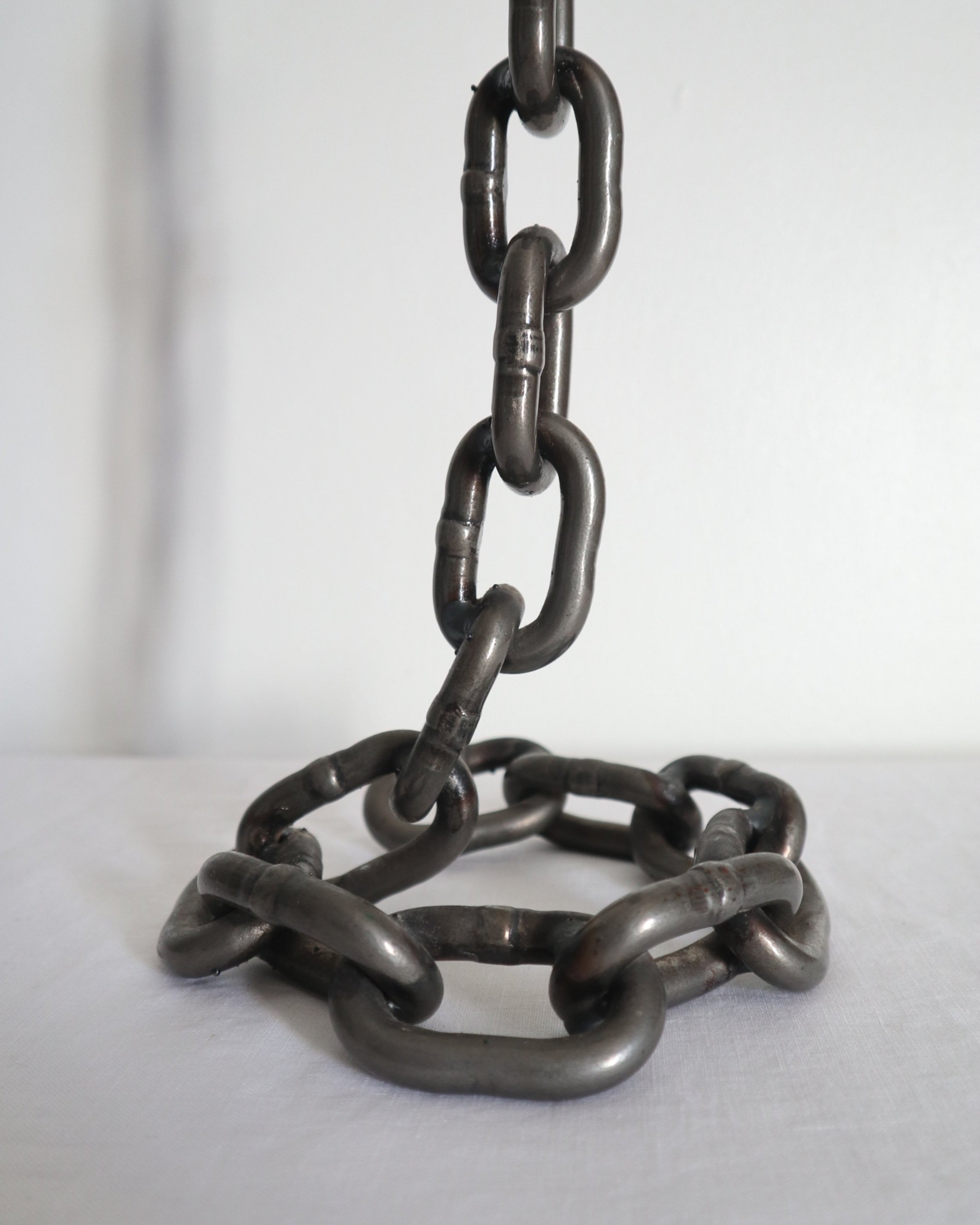 Heavy, vintage Brutalist chain link candlestick made from lacquered grey forged iron.