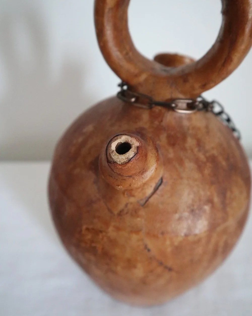 Spanish distressed tan leather covered oil or water pourer.