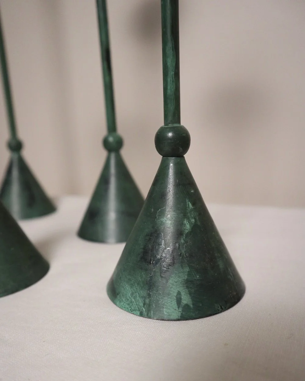 Set of 4 Postmodern verdigris metal candleholders, circa 1980s. In the Memphis style of Christian de Beaumont.