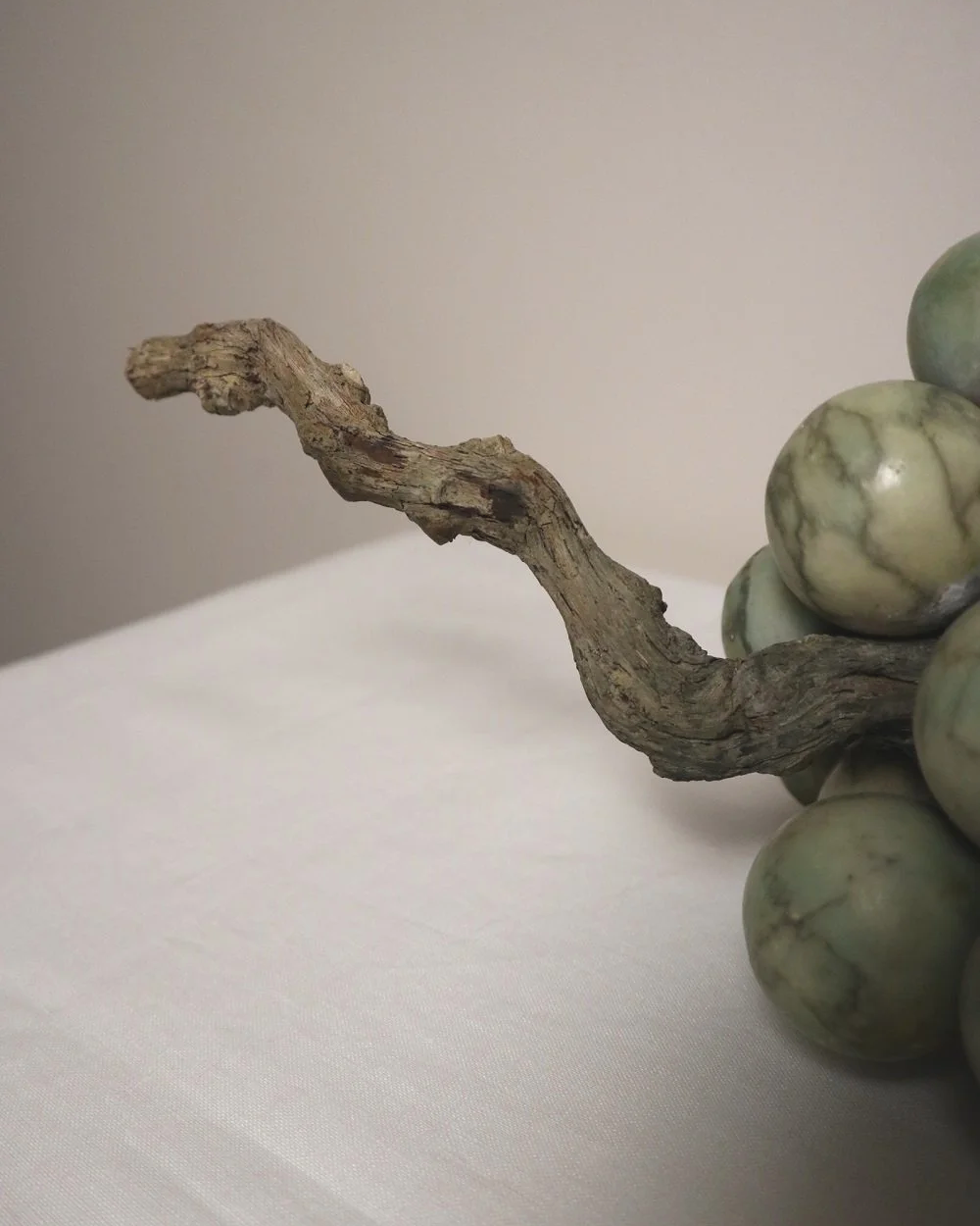 Large 1970s cluster of green alabaster grapes with real vine stem.