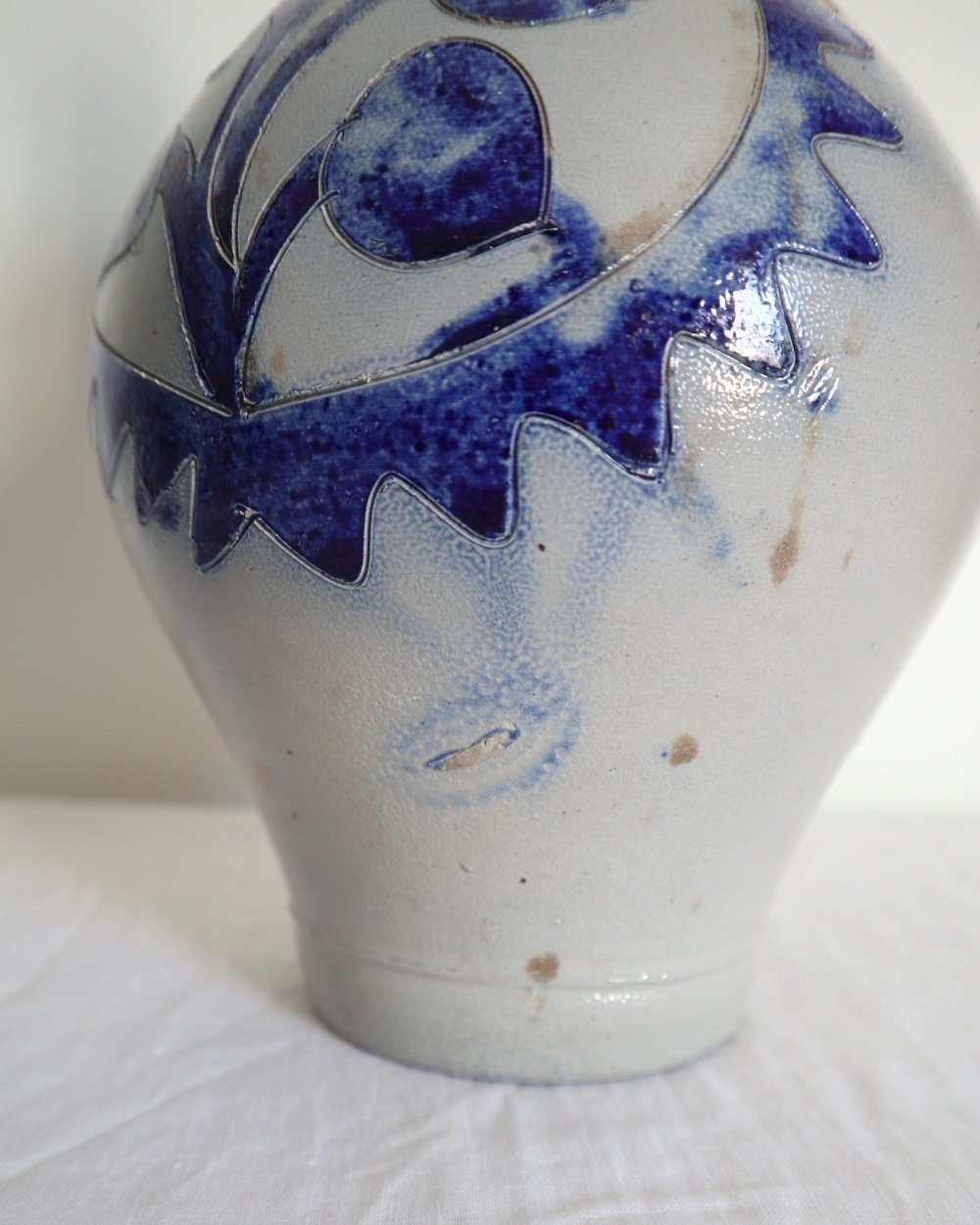 Large vintage German Westerwald salt glazed stoneware flagon with cobalt blue foliage decoration and two bands to the neck.