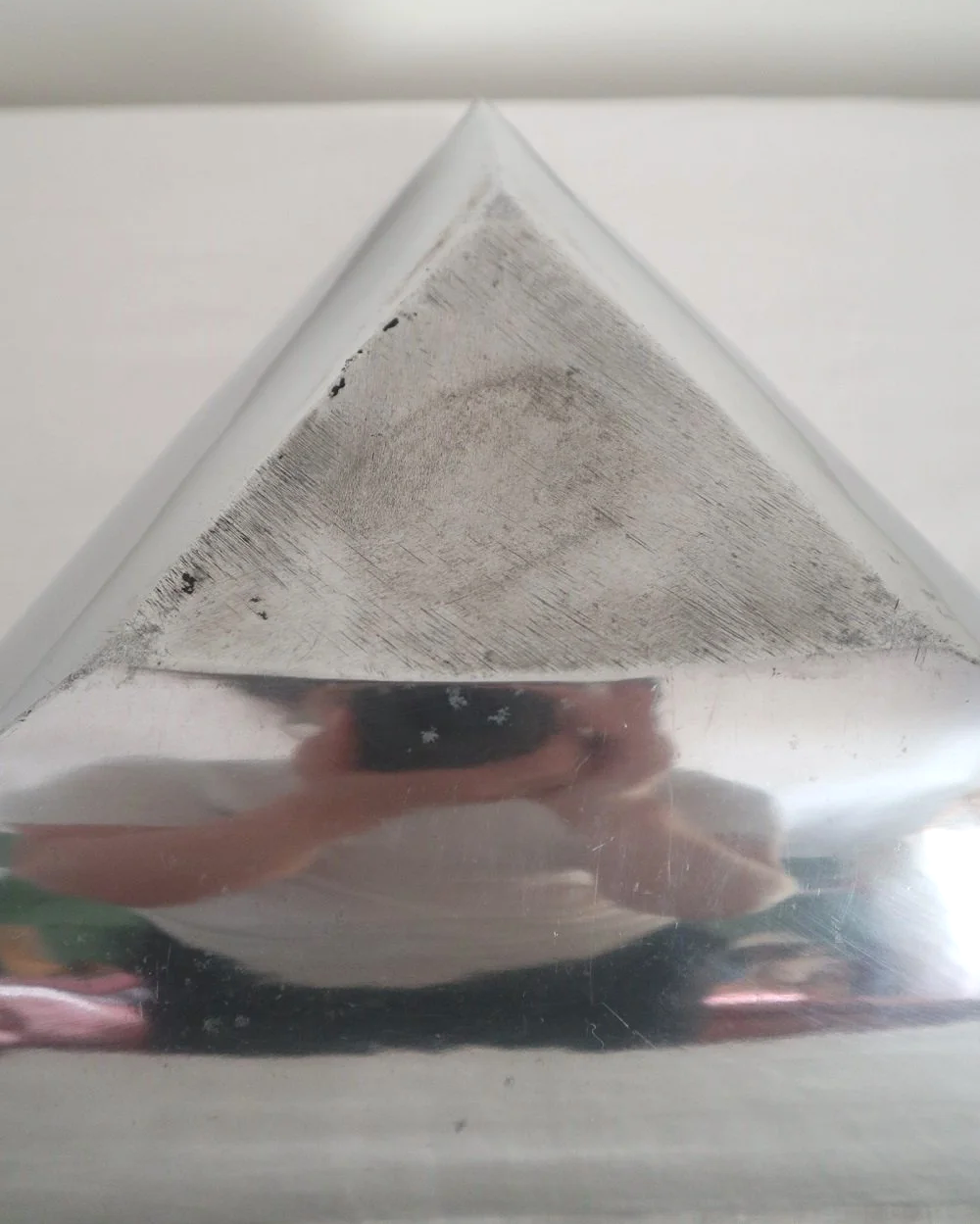 Solid shiny aluminium triangular Modernist style dish.