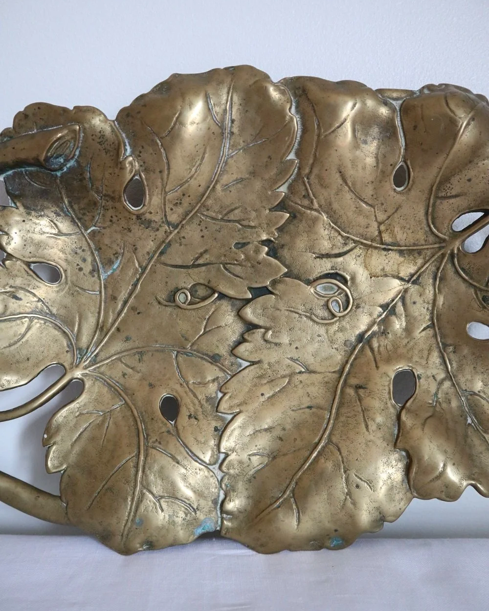 Vintage solid brass decorative Art Nouveau dish of intertwined grapevine leaves, circa 1960s.