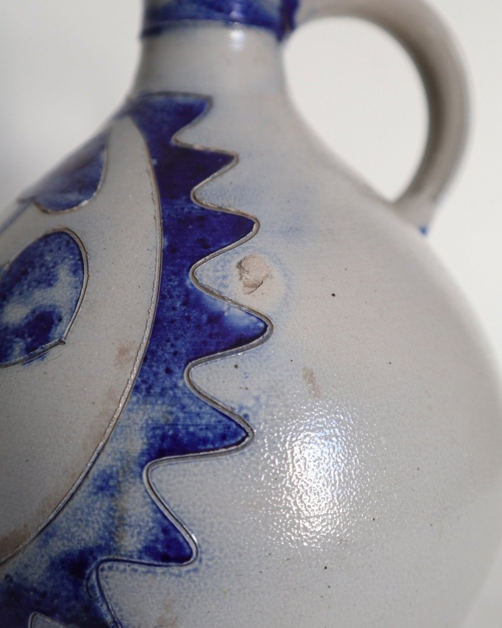 Large vintage German Westerwald salt glazed stoneware flagon with cobalt blue foliage decoration and two bands to the neck.