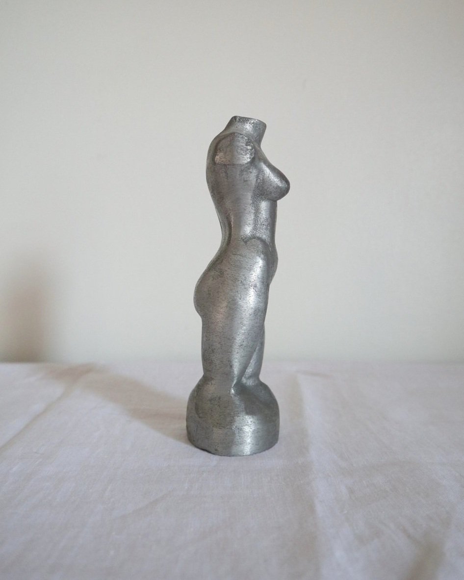 Modernist cast aluminium naked torso sculpture.