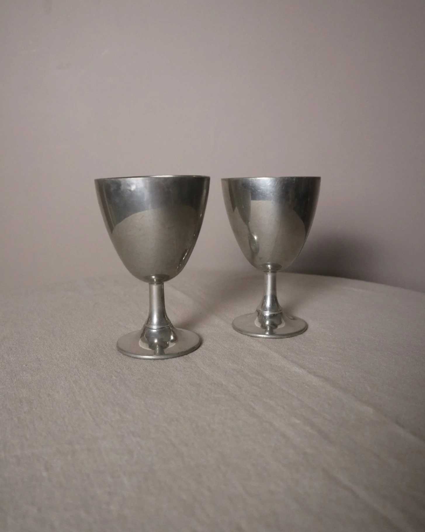 Pair of British P.H. Vogel & Co pewter goblets. Made in England. Circa 1970s.
