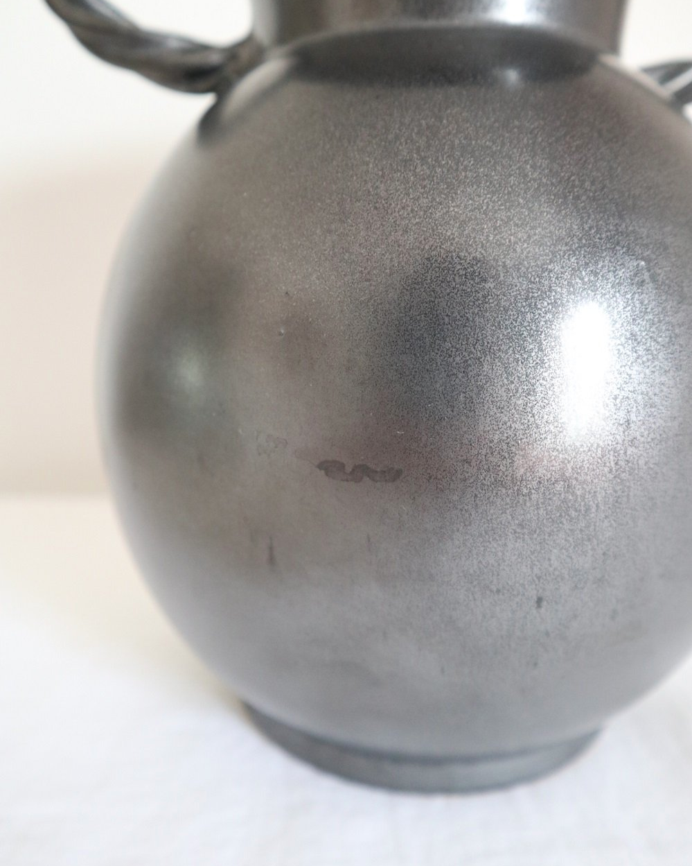 Large glossy, metallic black vase with double twisted handles and contrasting, yellow crackled glaze interior. Typical of Elchinger productions, France. Circa 1950s