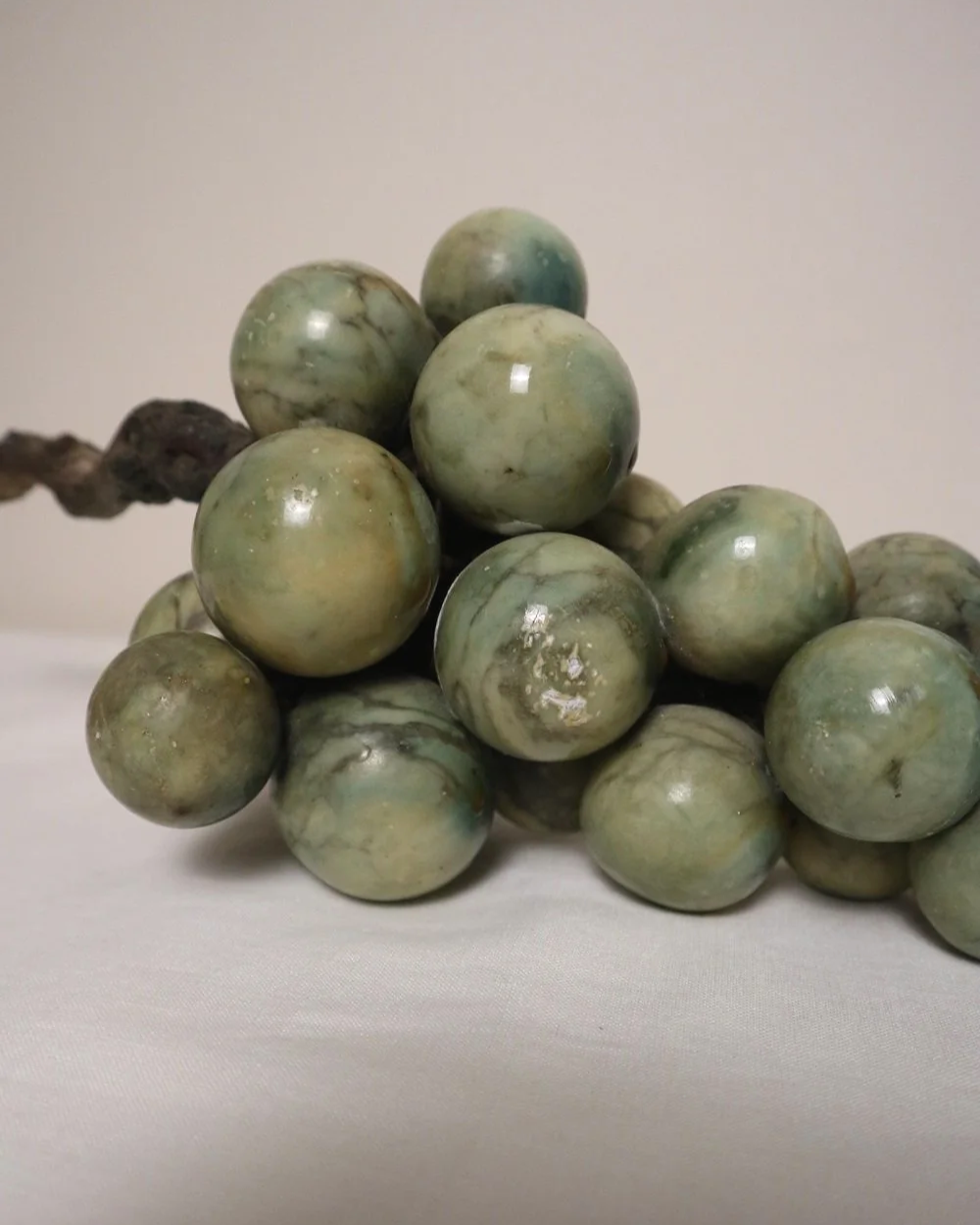 Large 1970s cluster of green alabaster grapes with real vine stem.
