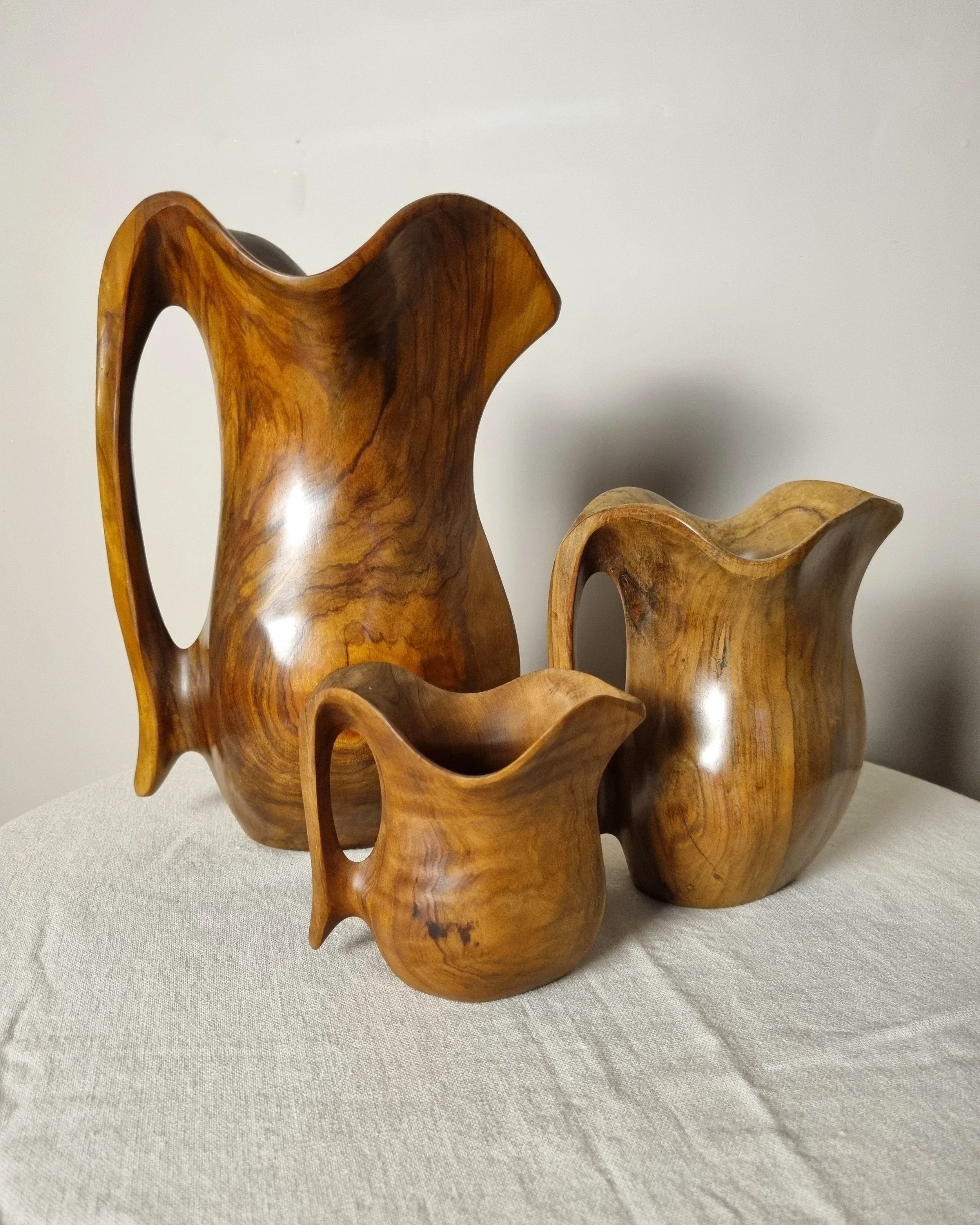Small mid century hand carved sculptural olivewood jug in the style of Alexandre Noll. Circa 1960s.