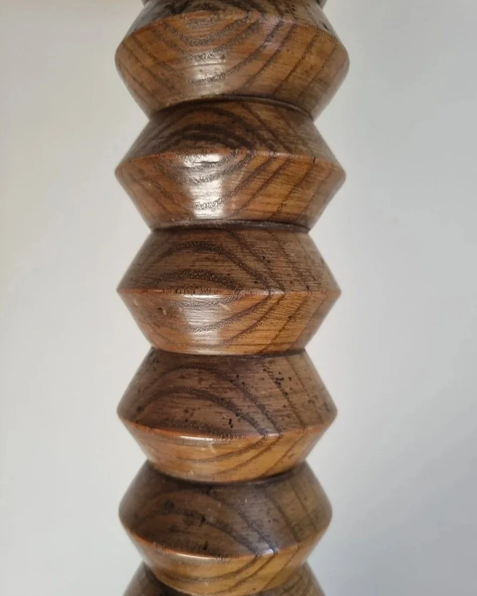 French, tall carved wooden Brutalist floor lamp with shelf platform in the manner of Charles Dudouyt, circa 1940s.
