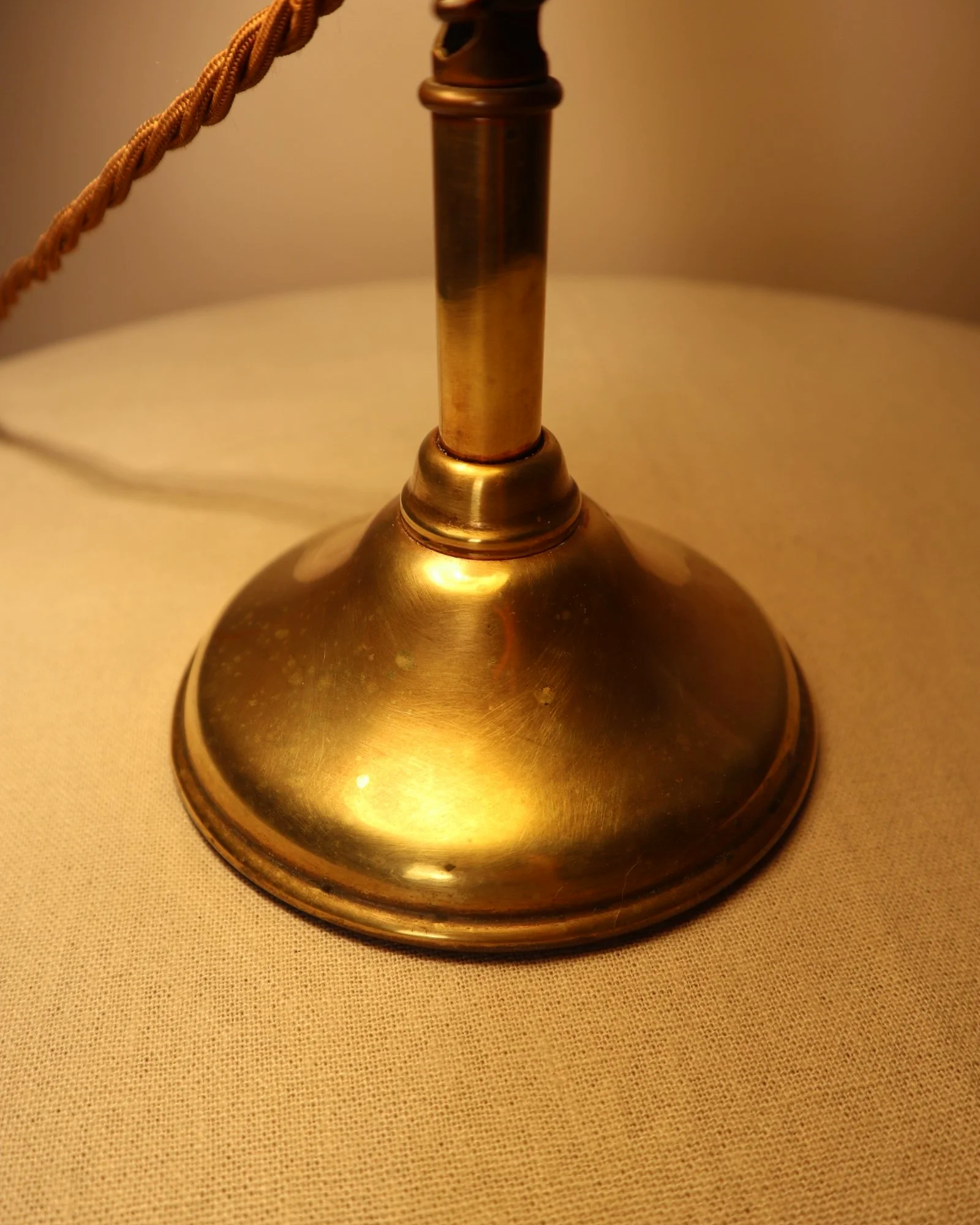 Small, vintage adjustable brass worker's desk lamp. Can be freestanding or attached to the edge of a workbench etc with clamp.