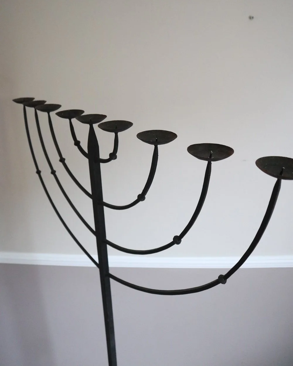 Large Brutalist wrought iron 9 arm Hanukkah candleholder. Circa 1970s.