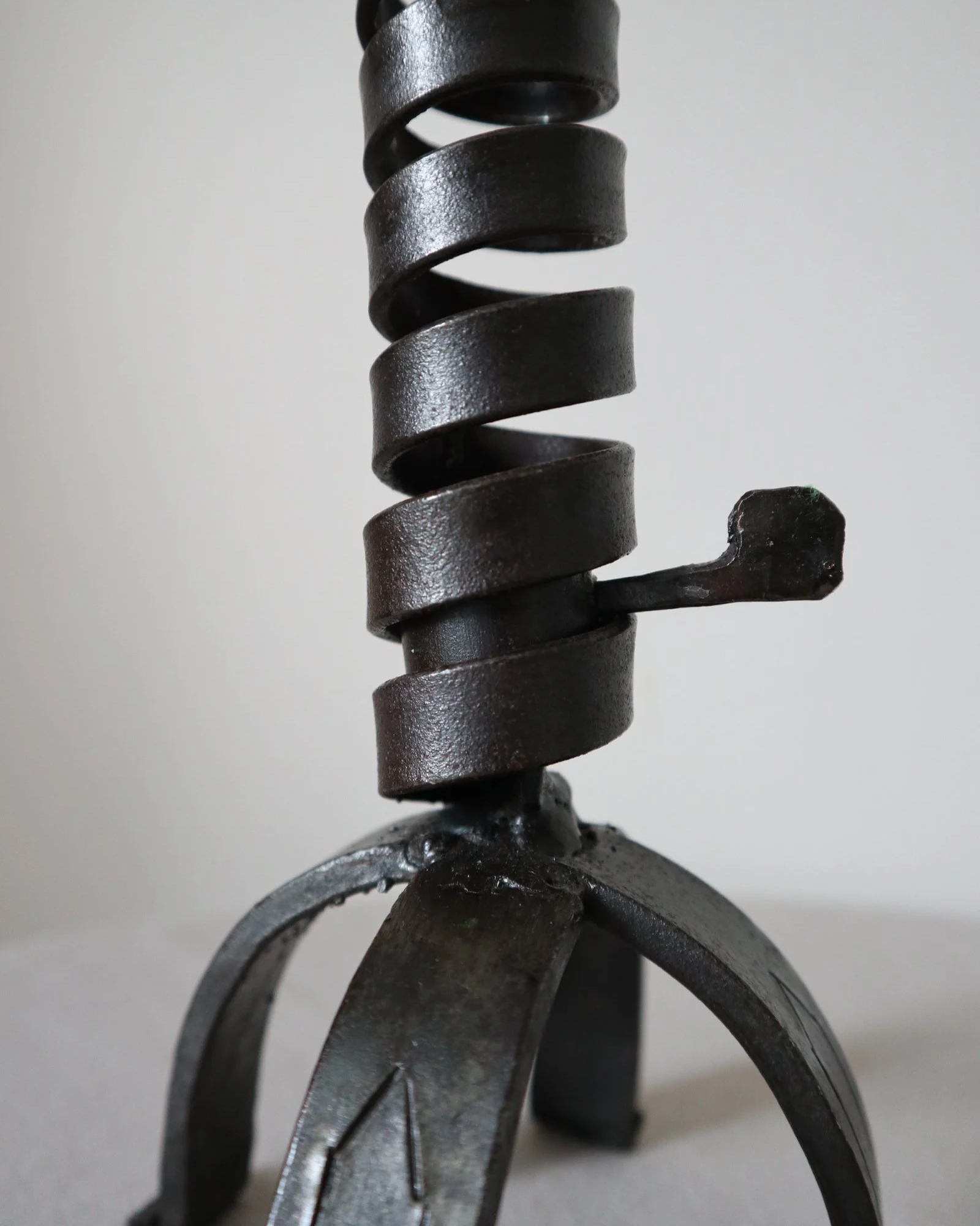 Vintage wrought iron ‘rat de cave’ style candleholder with turning spiral mechanism which raises the candle as it burns lower.