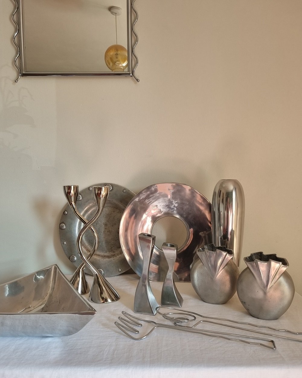 Pair of sculptural solid aluminium candleholders, circa 1970s.