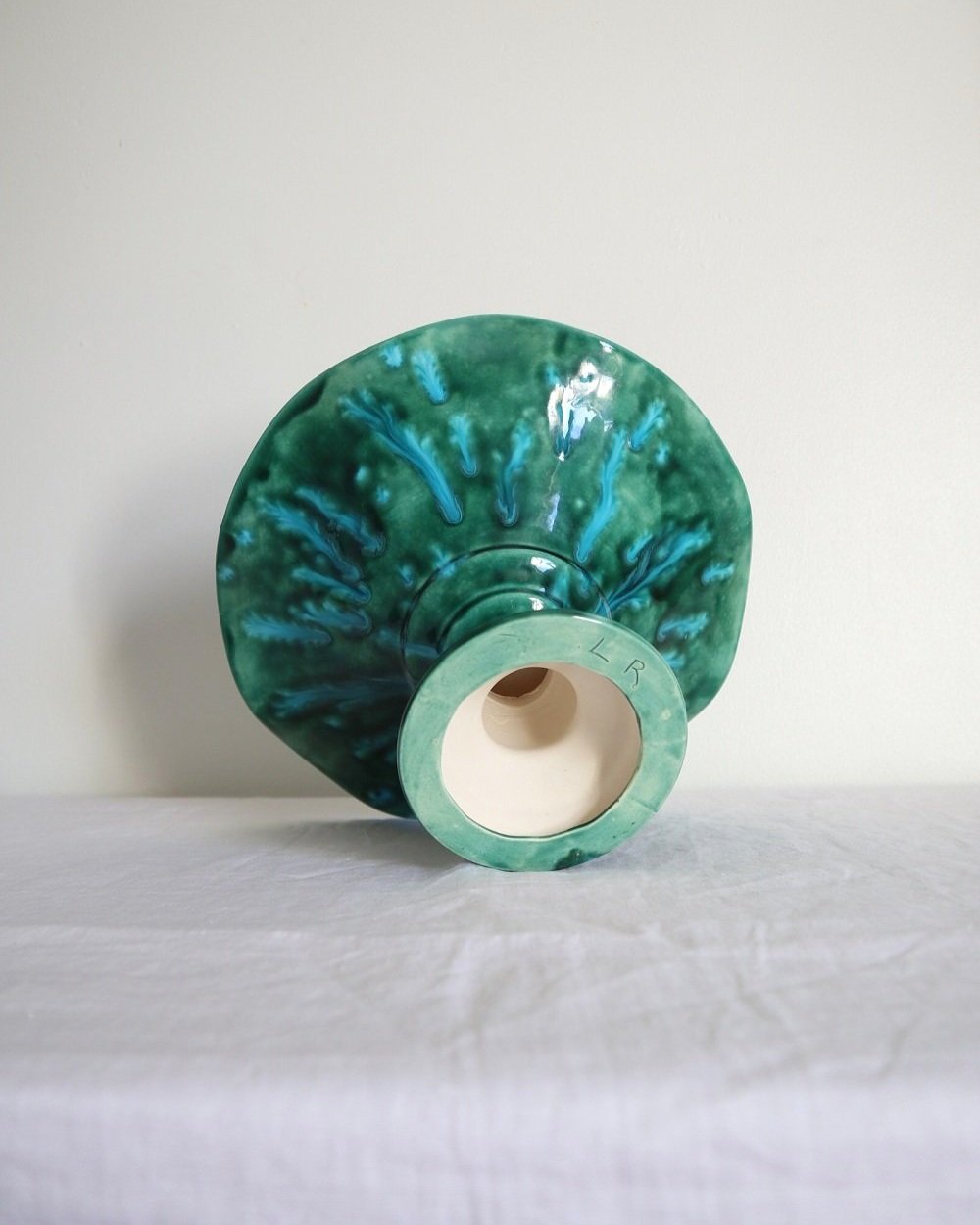 Studio pottery vibrant blue green shiny drip glaze pedestal cake stand / dish with wavy edge.