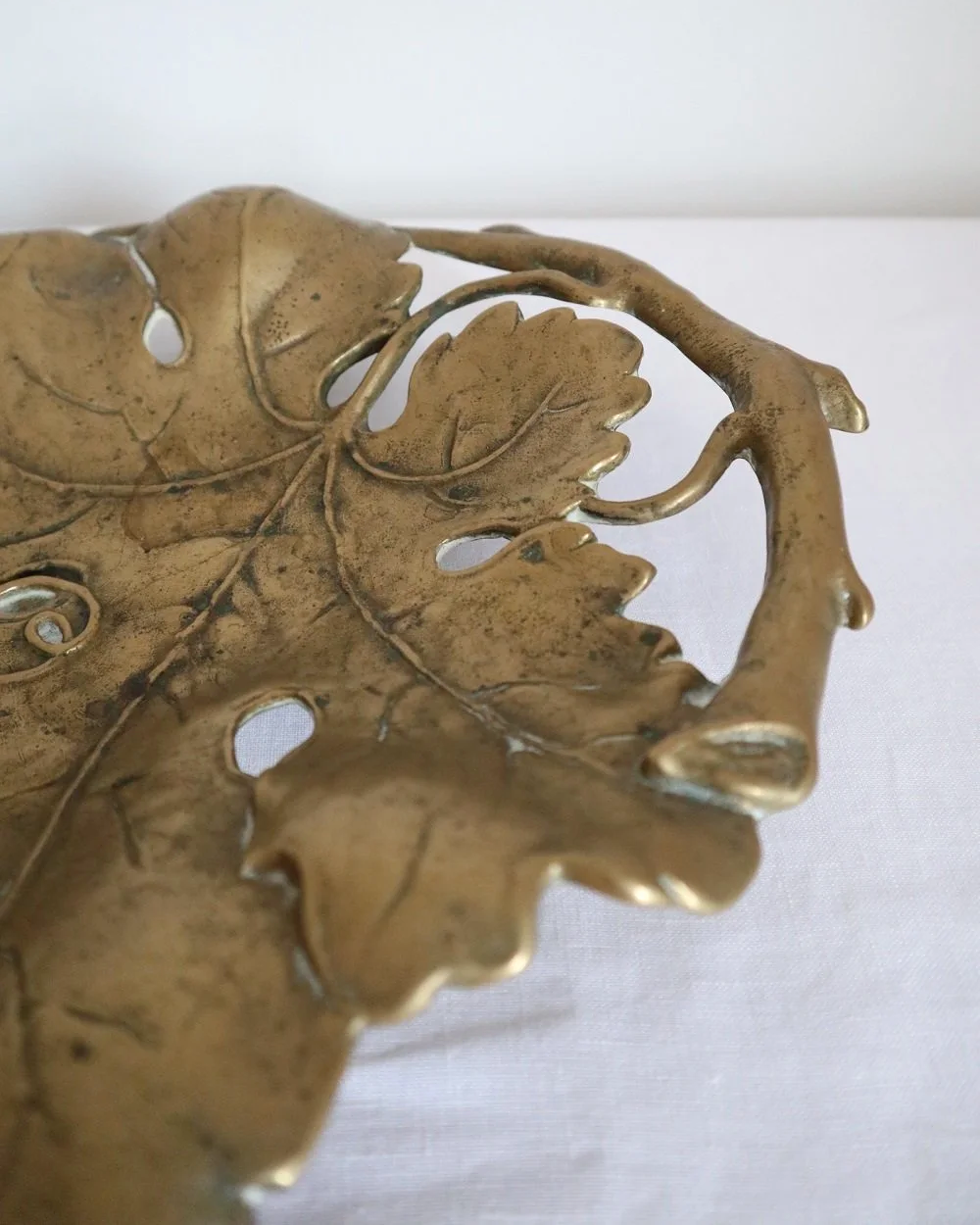 Vintage solid brass decorative Art Nouveau dish of intertwined grapevine leaves, circa 1960s.