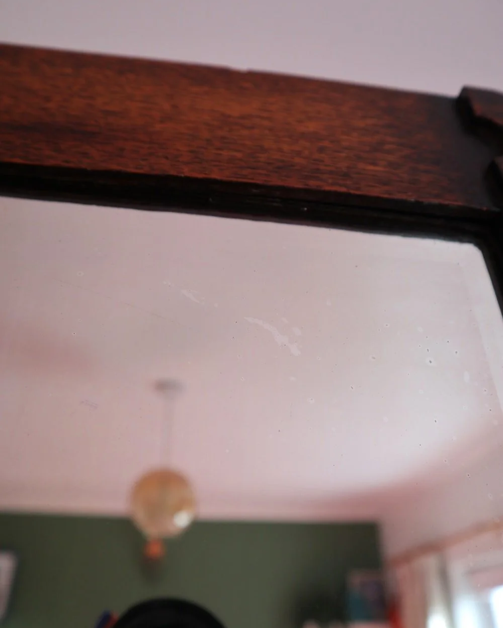 Arts & Crafts square wooden framed mirror with carved corner detailing. Circa 1930s.