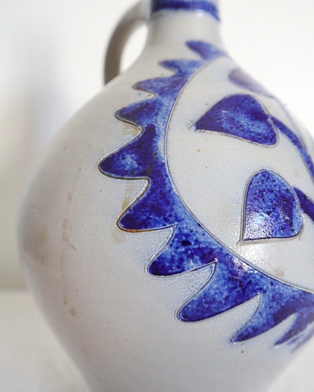 Large vintage German Westerwald salt glazed stoneware flagon with cobalt blue foliage decoration and two bands to the neck.